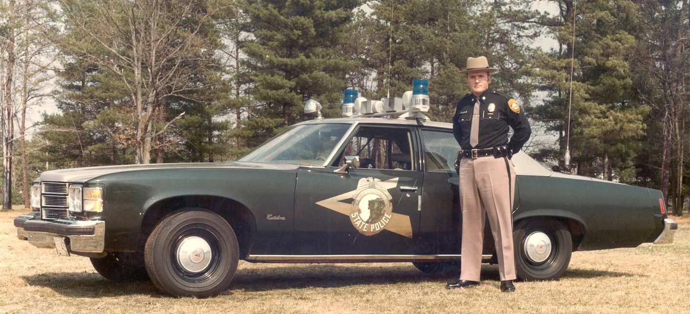 New Hampshire police officers and car